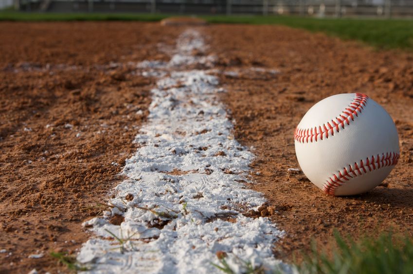 baseball in the infield near the chalk line